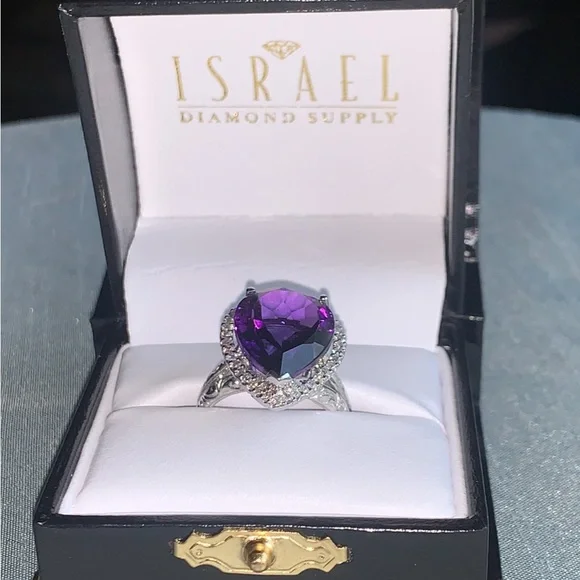 NWpaperwork. Pear Amethyst and round diamond ring.